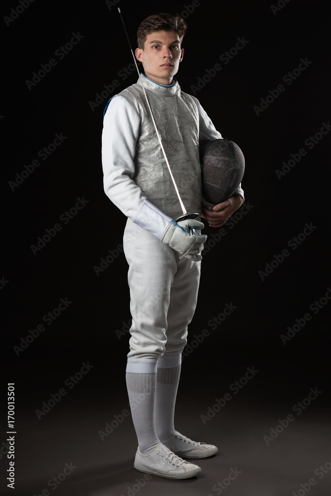 Handsome Young male fencer in white fencing costume Handsome Young male fencer in white fencing costume