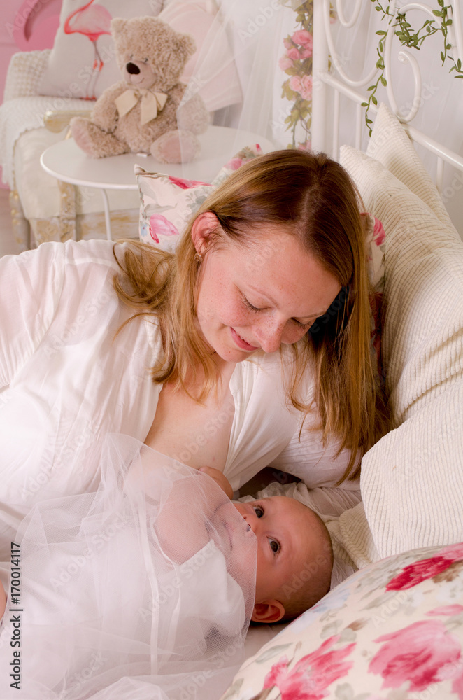 Happy mother with newborn baby