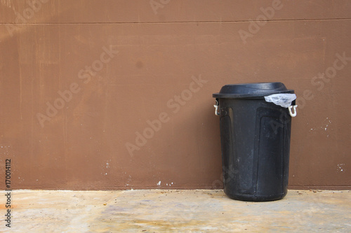 black bin and wall on the road