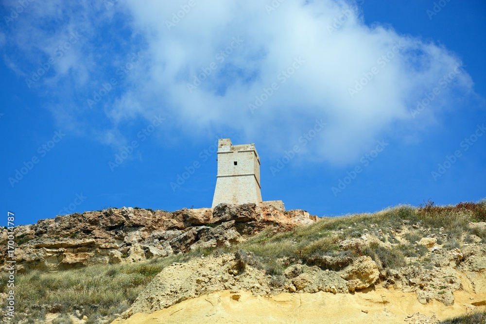 View of Ghajn Tuffieha watchtower which overlooks the coastline, Ghajn Tuhheiha Bay, Malta.