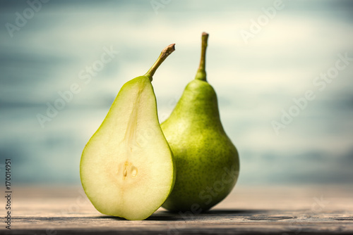 Close up of fresh pears over defocused background
