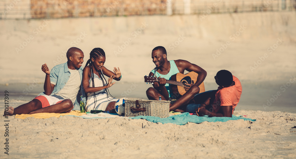 Group of people hanging out at the beach Group of people hanging out at the beach