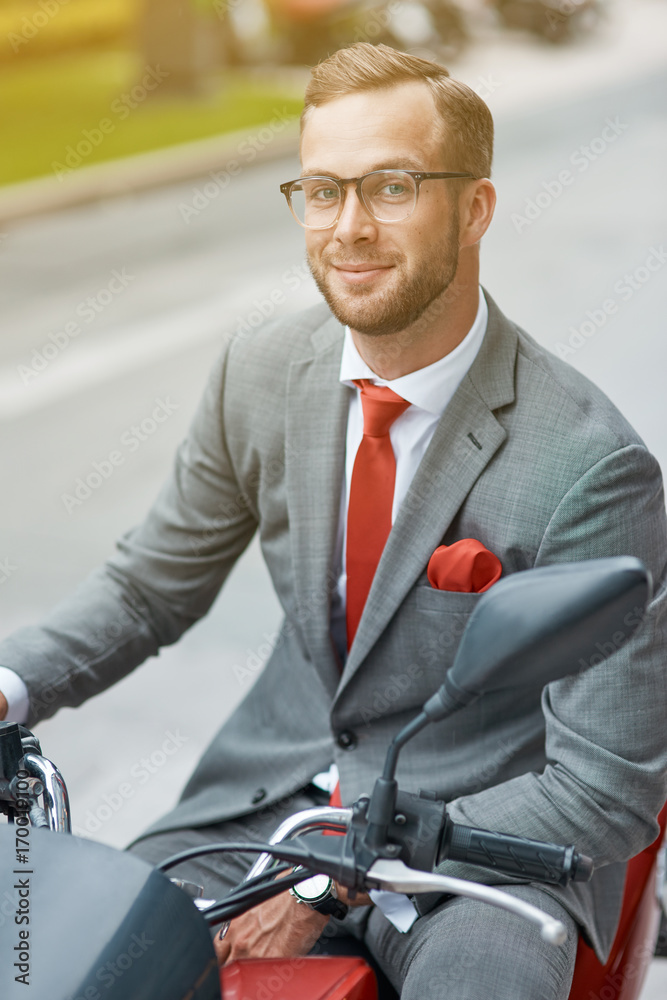 Positive businessman going to ride a bicycle Positive businessman going to ride a bicycle