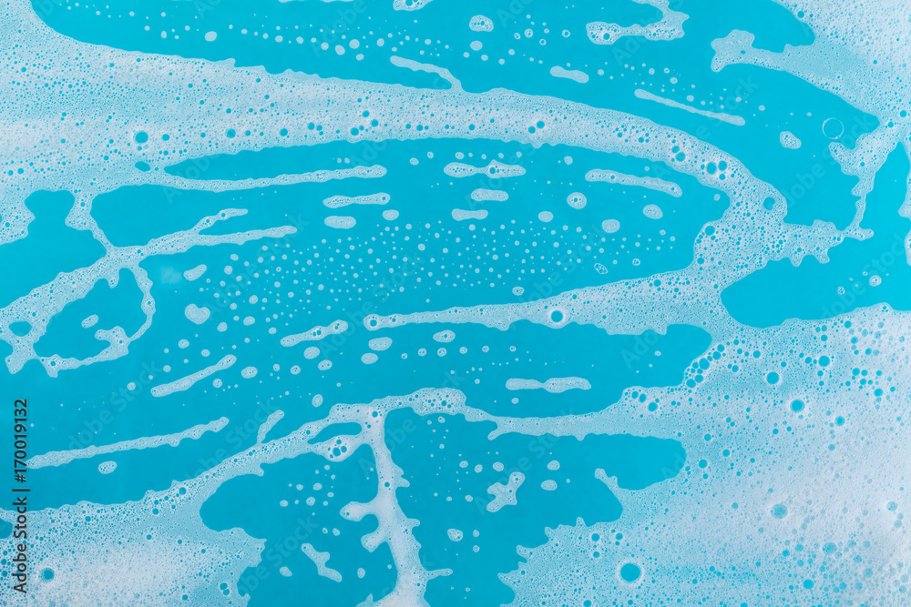 Fotografie soap foam on a blue background