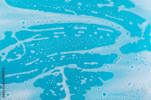 фотографія soap foam on a blue background