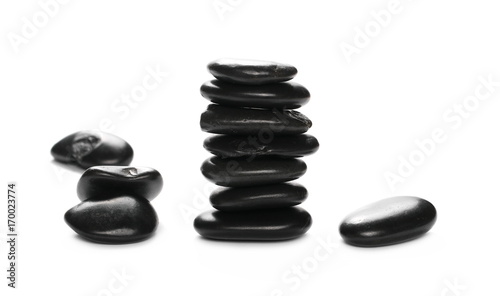 Pile black rocks isolated on white background and texture