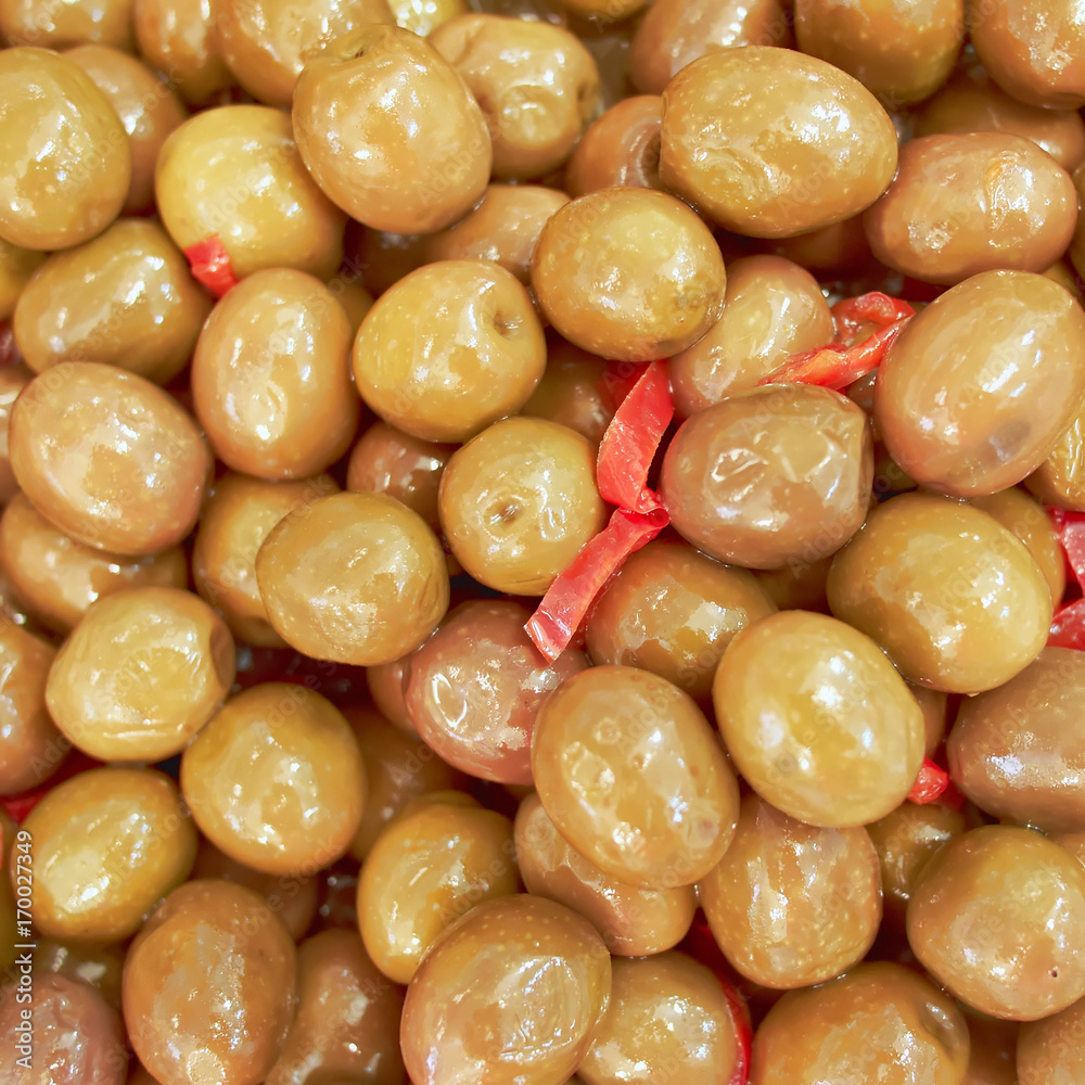 organic green olives in brine top view, tasty background organic green olives in brine top view, tasty background