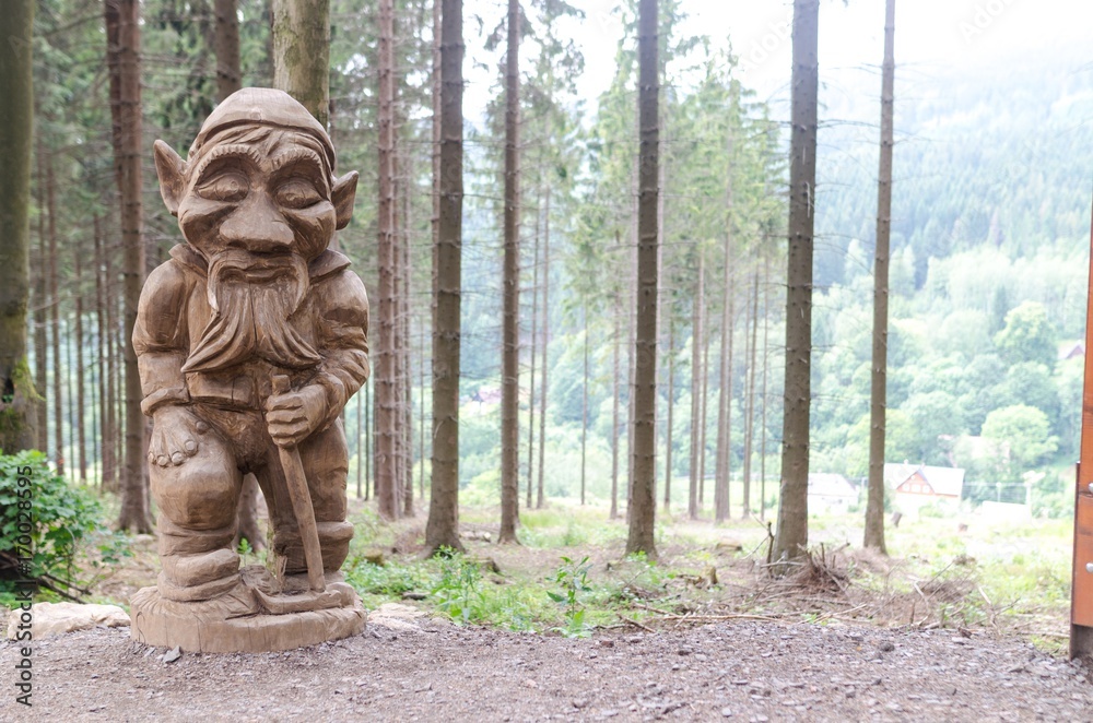 Wooden statue in forest dolni morava