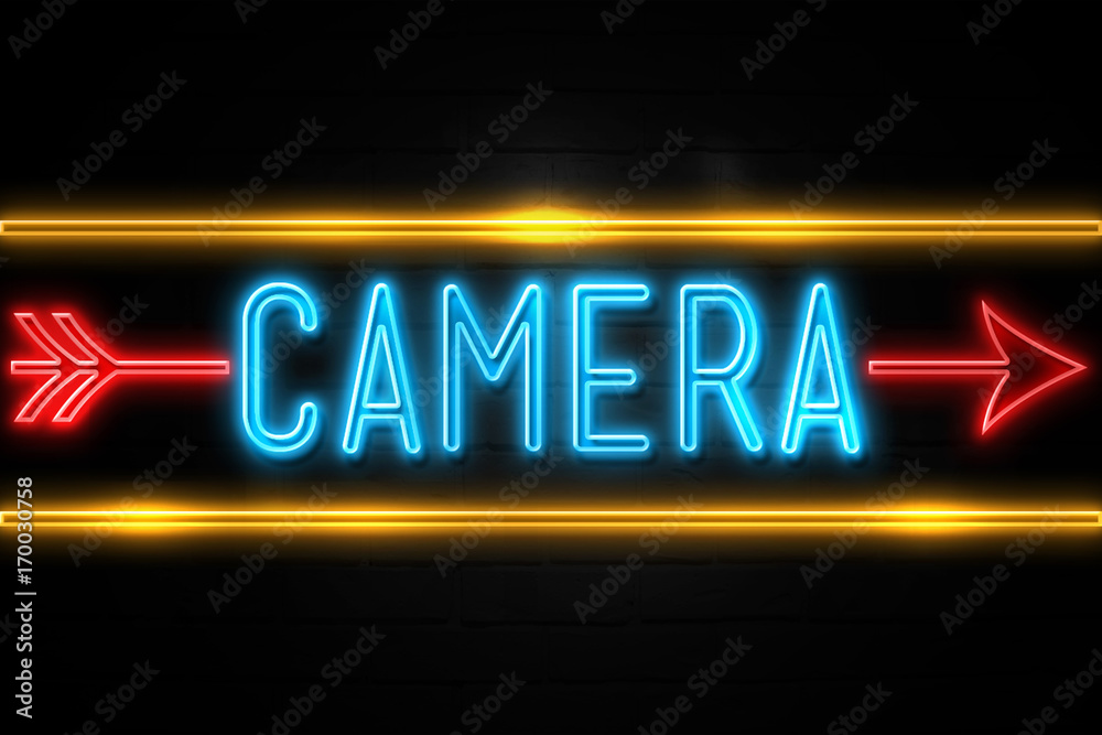 Camera - fluorescent Neon Sign on brickwall Front view Camera - fluorescent Neon Sign on brickwall Front view