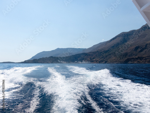 Sea view with ship trails and islands on horizon. Crete Greece