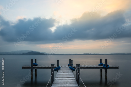 Wooden pier. Sunset on the lake. © patma145