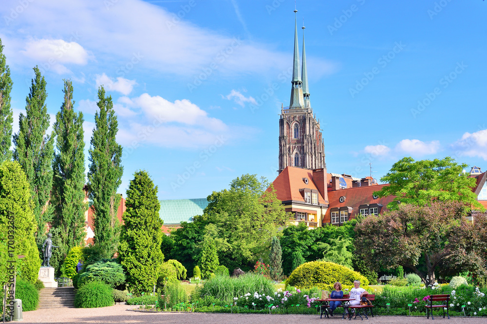 Obraz premium WROCLAW, POLAND - JUNE, 2017: Botanical garden of Wroclaw. View of the cathedral.