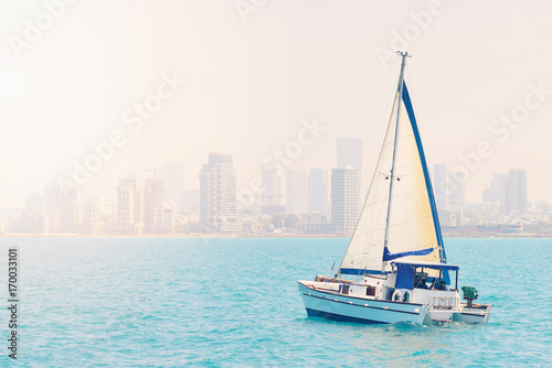 TEL AVIV, ISRAEL - APRIL, 2017: luxury yacht in the open sea against the backdrop of Tel Aviv.