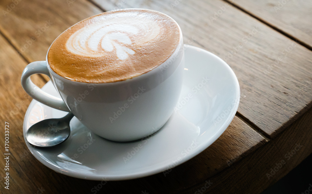 Closeup of barista made coffee with froth art