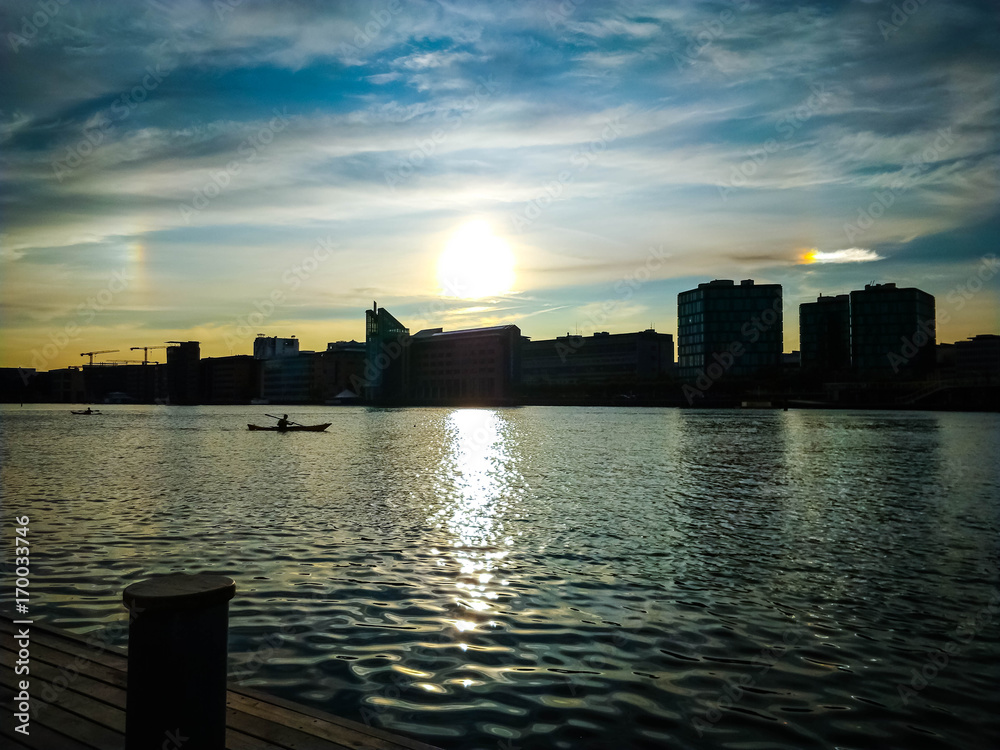 Sunset with a Rainbow Sky reflection in the Copenhagen harbour - Klavebod Brygge from Islands  Brygge, Amager  With Space For copy