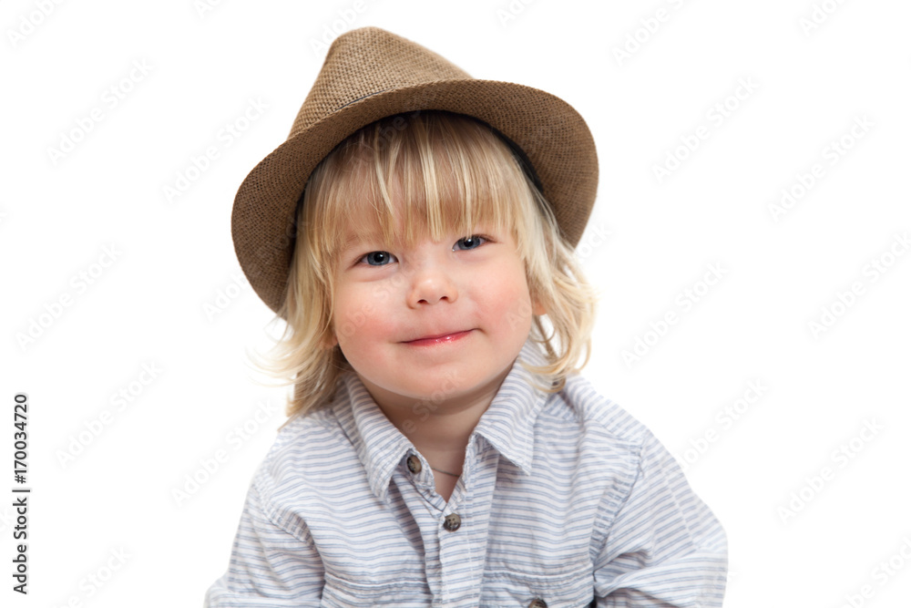 A two years old boy in straw hat isolated on white background A two years old boy in straw hat isolated on white background