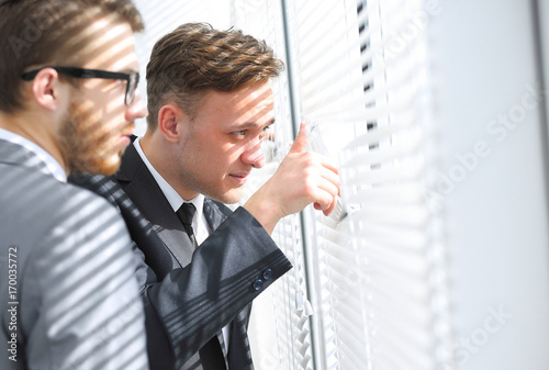 business people look in the window office