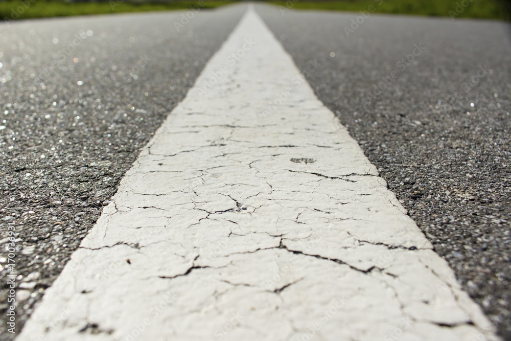 Obraz premium Retreating asphalt road macro background