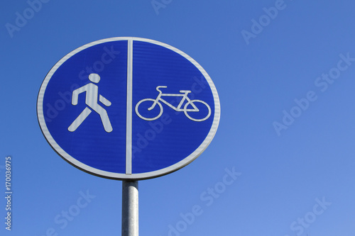 Sign cycling track against the blue sky