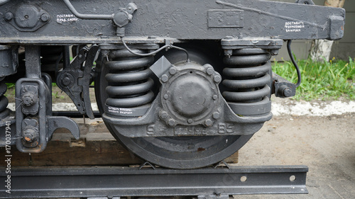 Close up picture of a metal wheel of train with amortisation system.