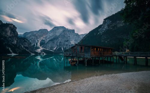 A famous boathouse at Braies Lake Lago di Braies  Pragser wildsee in the moonlight. Trentino Alto Adidge  Dolomites mountains  Italy.