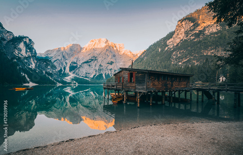 A famous boathouse at Braies Lake (Lago di Braies, Pragser wildsee). Trentino Alto Adidge, Dolomites mountains, Italy.