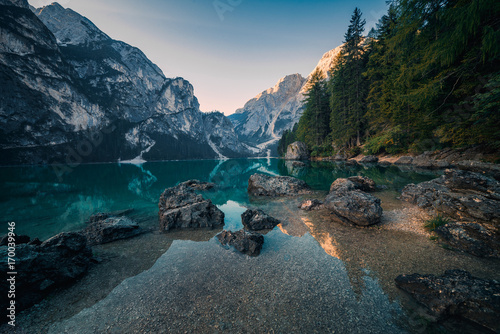 Amazing view of Lago di Braies (Braies lake, Pragser wildsee) at sunrise. Trentino Alto Adidge, Dolomites mountains, Italy.