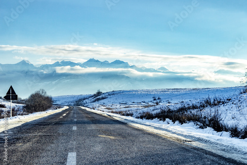 Winter road under the mountains