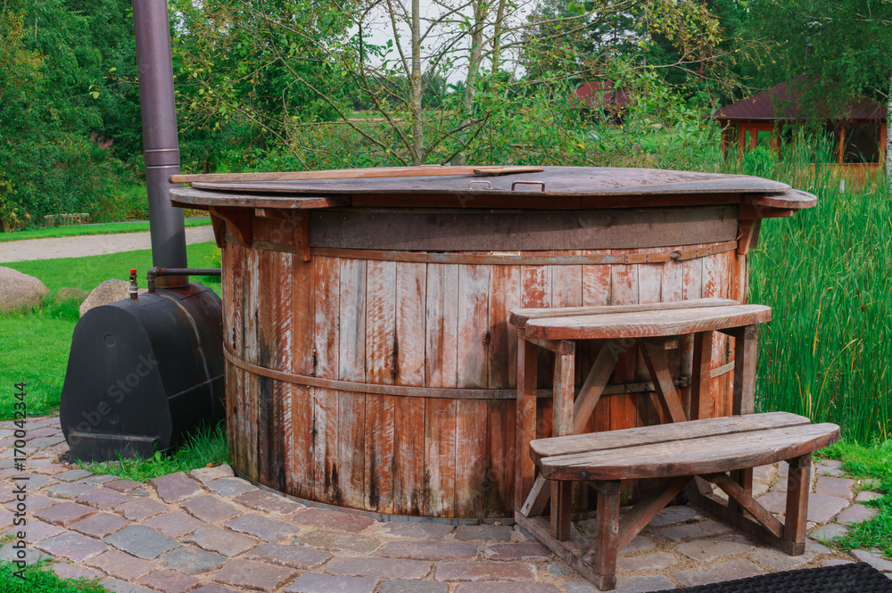 a barrel with heated water, for taking water procedures, a barrel with heated water, for taking water procedures,