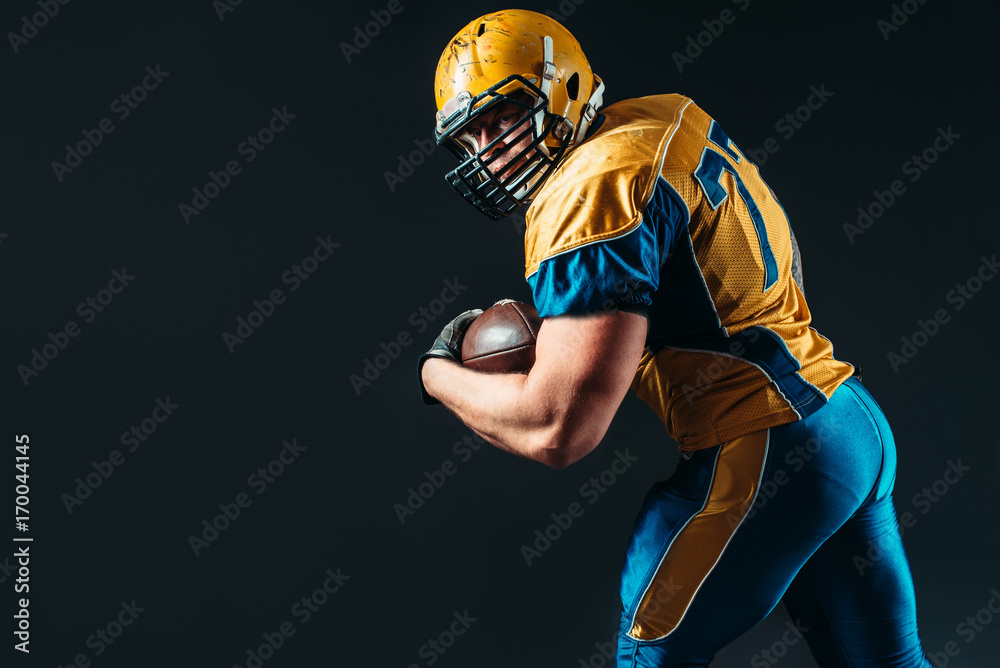 American football offensive player with ball