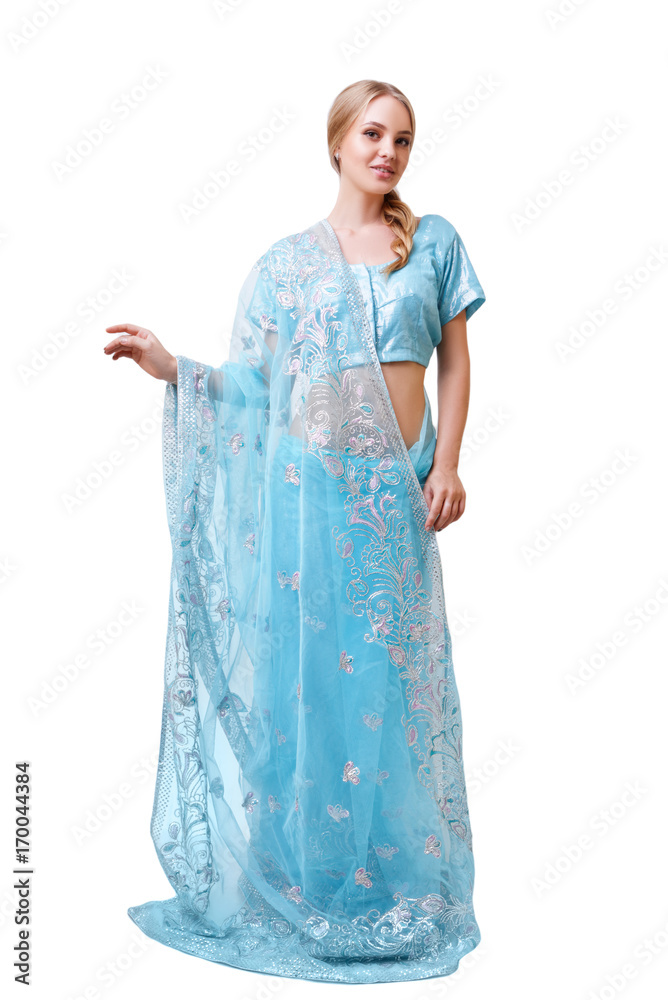 Caucasian young woman in blue indian national dress isolated