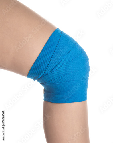 Knee wrapped in elastic bandage on white background,Kree pain