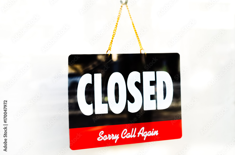Old Close sign hanging front of cafe mirror door. Old Close sign hanging front of cafe mirror door.
