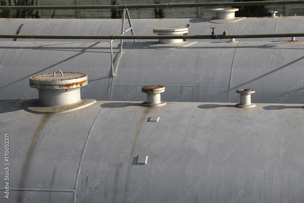 Huge gas storage tanks in an industrial area. Huge gas storage tanks in an industrial area.