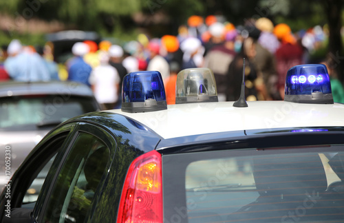 Police patrol cars flashing sirens