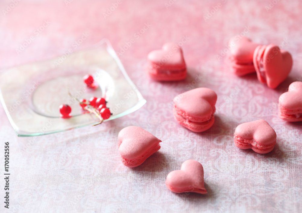 Pink Macaron Hearts with Red Currant Filling, on light pink background. Pink Macaron Hearts with Red Currant Filling, on light pink background.