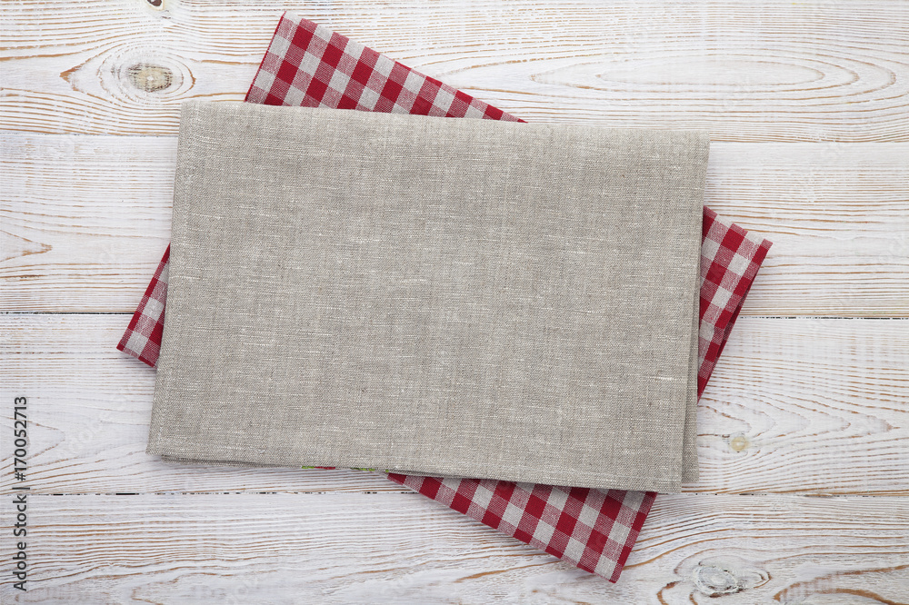 Fototapeta premium Napkin on table in perspective. Napkin close up top view mock up for design. Place for text