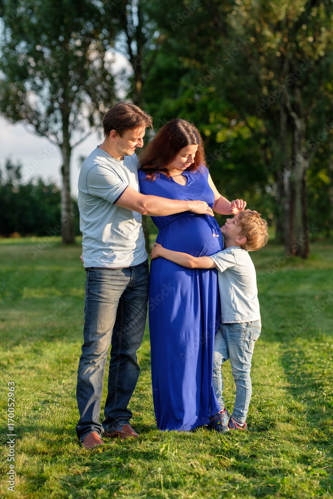 Happy pregnant family of three expecting new baby Happy pregnant family of three expecting new baby