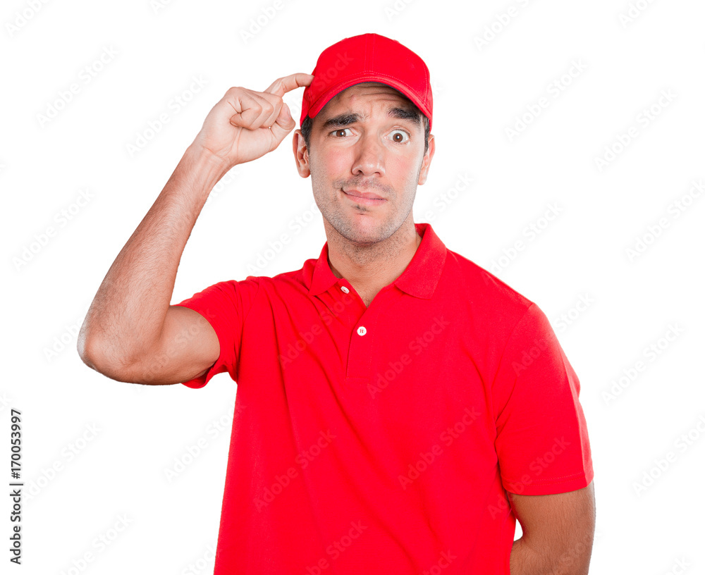 Worried delivery man with a gesture of confusion