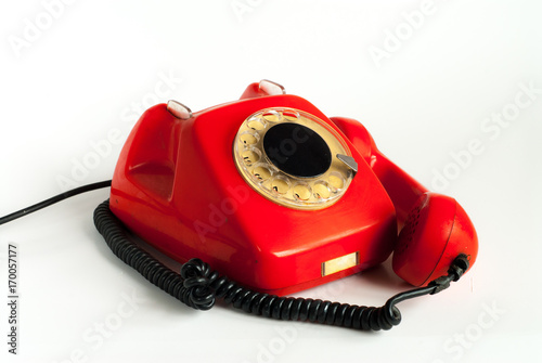 An alarmed old telephone with a put away handset