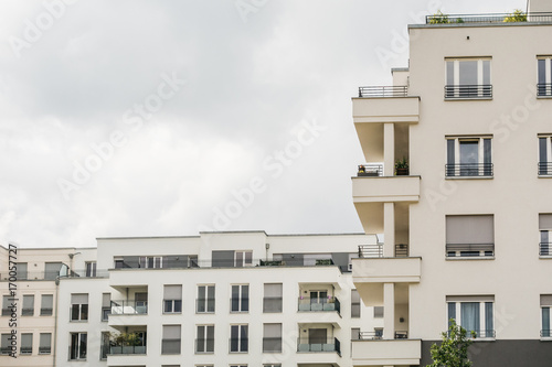 detailed view of apartment house with copy space in the cloudy sky © Robert Herhold