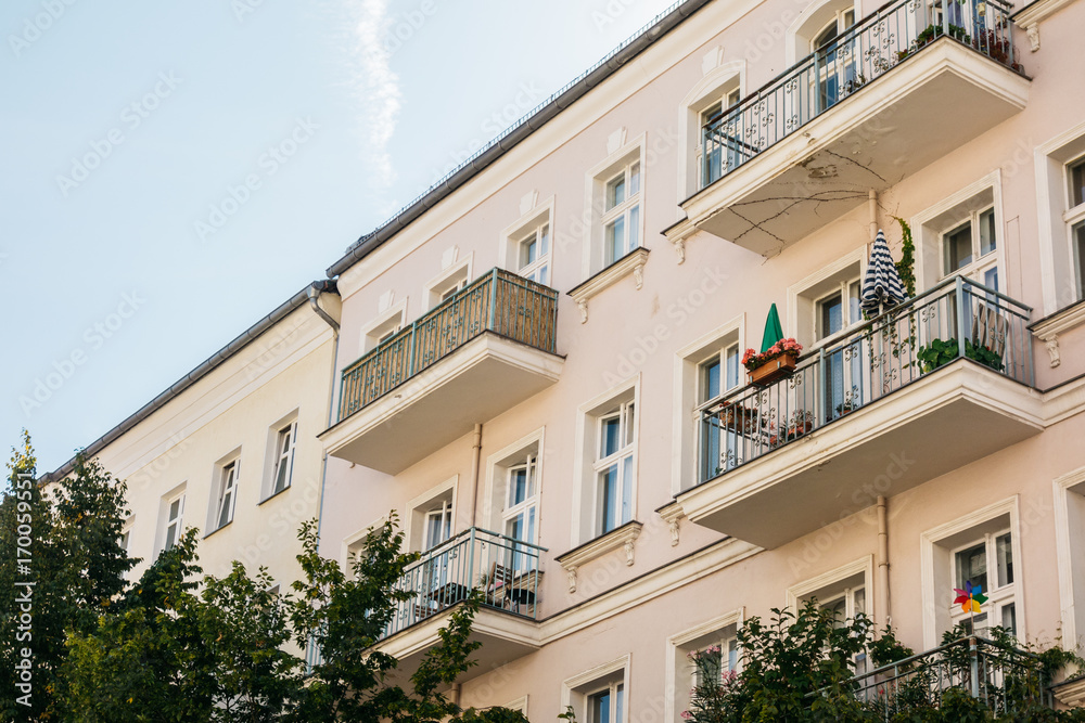 detailed view of yellow house with steel balcony