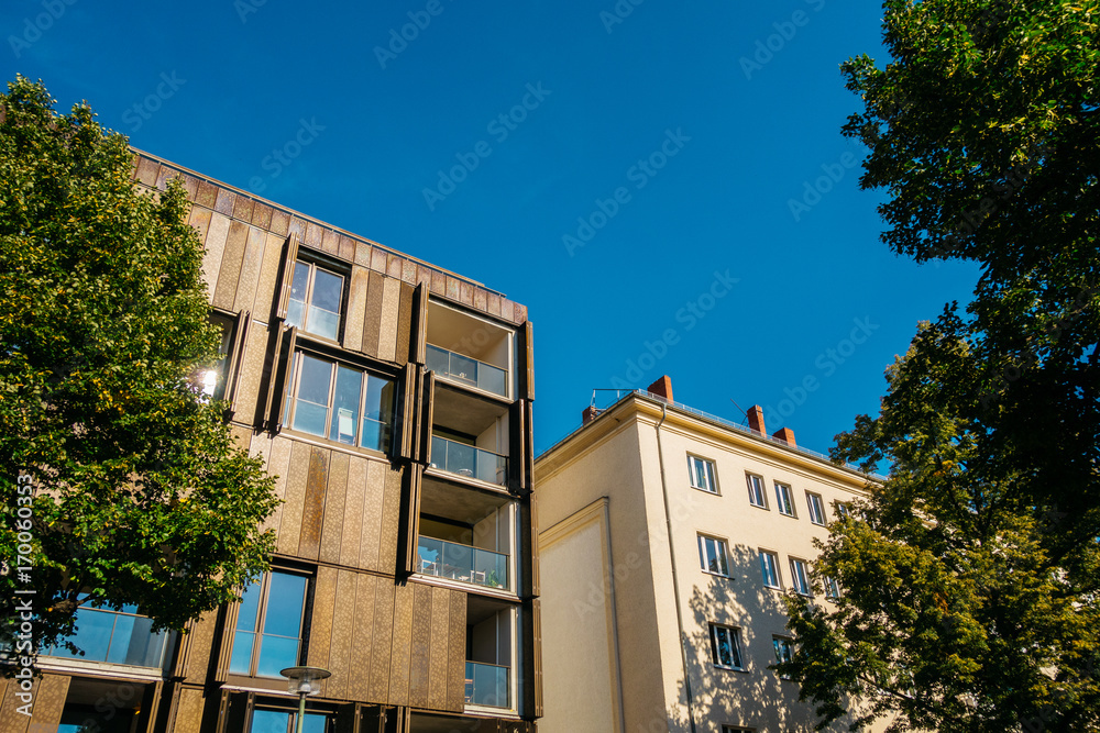 modern house next to an older one