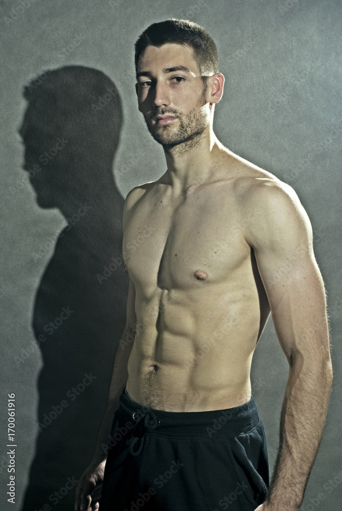 Portrait of young male body-builder