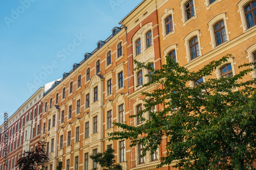 warm colored brick buildings in a row at summer