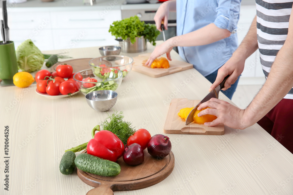 Chef giving cooking classes in kitchen Chef giving cooking classes in kitchen
