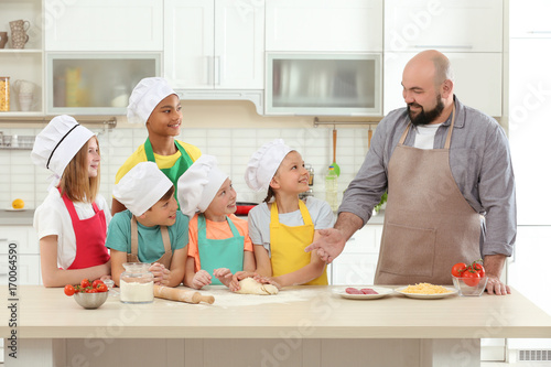 Group of children and teach...