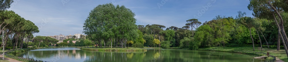 Eur area park outdoor lake, a big green park bihind the city center. A green meadow for relax time in Rome