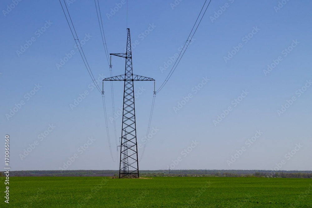 High voltage power line against blue sky