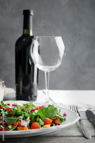 Plate with useful beet salad on table